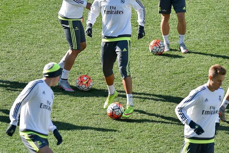 Cristiano Ronaldo (centre), in a team training session, erased all doubts about his form this season when he plundered five goals in a Spanish La Liga game against Espanyol on Saturday.