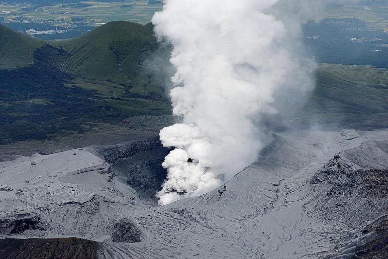 Mount Aso, which has been rumbling since last year, was seen spewing ash and smoke yesterday. Police officers and firefighters evacuated about 30 tourists and shop workers who were near the volcano. There were no immediate reports of injuries or casu