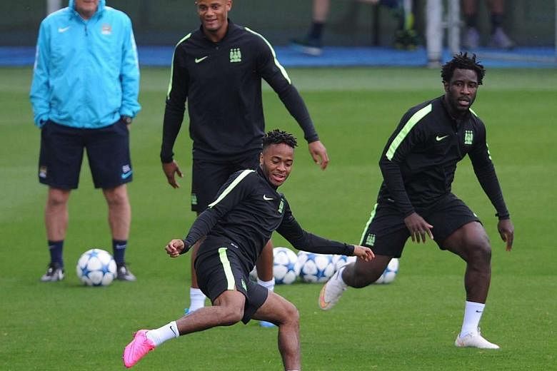 Manchester City, with Raheem Sterling (on the ball), Vincent Kompany and Wilfried Bony (right) in training, could be hobbled by the absence of the injured Sergio Aguero up front. They have been warned to be wary of Juventus who have not won yet since the 