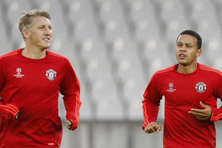 Manchester United's Bastian Schweinsteiger (left) and Memphis Depay during training. Depay, who moved to Man United from PSV Eindhoven in the summer, will be looking to make his mark against his former club. 