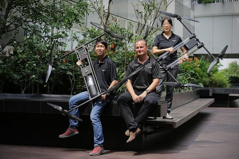 (From far left) Mr Yim Wai Tsyu, 25, drone operator, Mr Taras Wankewycz, CEO of Horizon Energy Systems, and Dr Li Aidan, senior research scientist, are involved in Horizon's development of a long-lasting fuel cell that is light and can power a drone 