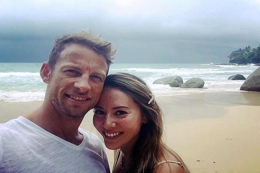 Button with his wife Jessica in Phuket, Thailand on Monday. Despite his relaxed air, he was there for rigorous endurance training sessions.