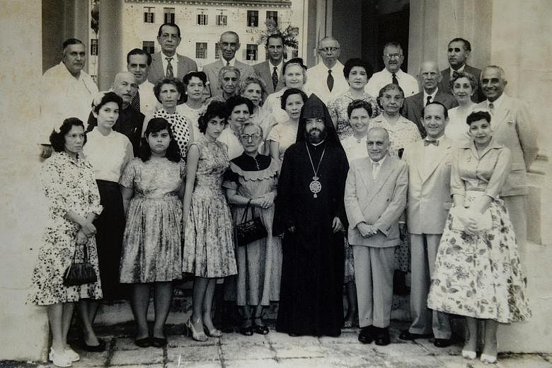 A younger Madam Loretta Sarkies (fourth from left in the front row) is seen in this picture taken with members of the Armenian community here in the 1950s, with a priest who was making a rare visit to Singapore. Her younger sister Jessica is to her r