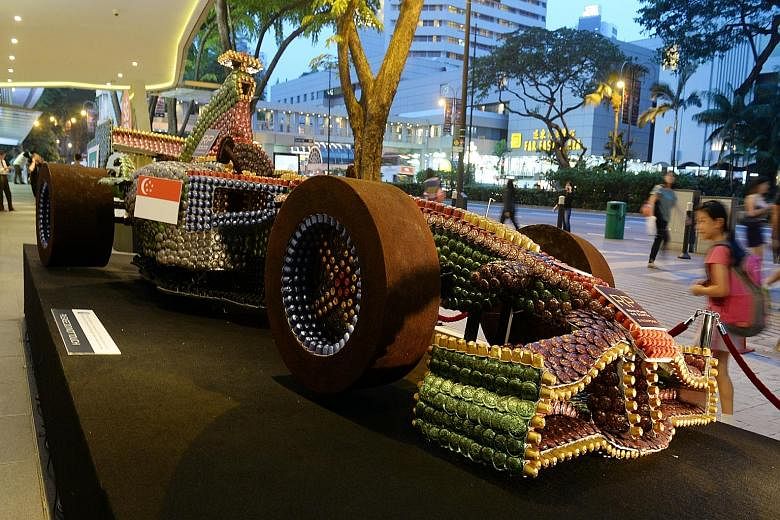 A replica F1 car made of coffee capsules and coffee grounds outside Royal Plaza on Scotts, created by its chefs.