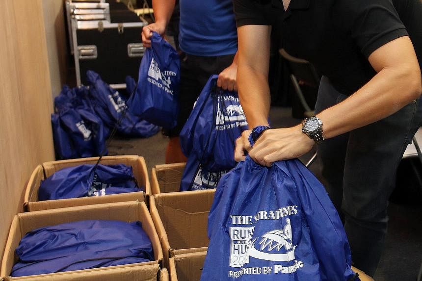 Participants of The Straits Times Run at the Hub on Sept 27 can look forward to a host of goodies in their race packs (above), which are up for collection from today to Sunday (10.30am to 8pm) at the Singapore Sports Hub's OCBC Arena Hall Five. The v