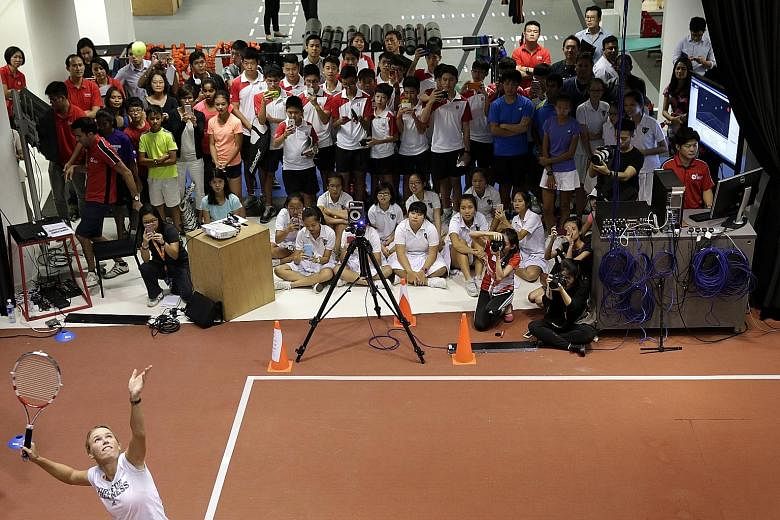 Besides serving up tips at the Singapore Sports Institute, Caroline Wozniacki also dissected what went right and wrong in her serves that were captured on video.