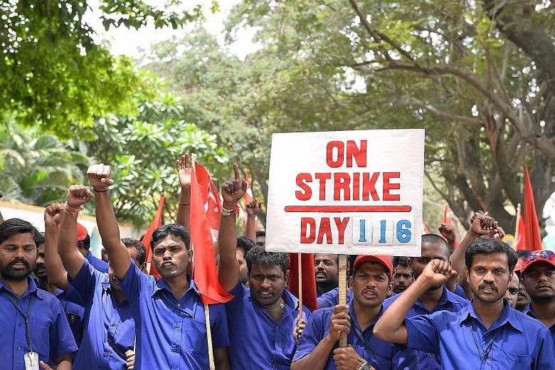 Trade union activists protesting against the central government's economic policies in Bangalore at a rally on Sept 2. The dearth of jobs for the country's growing workforce is a challenge for Prime Minister Narendra Modi.