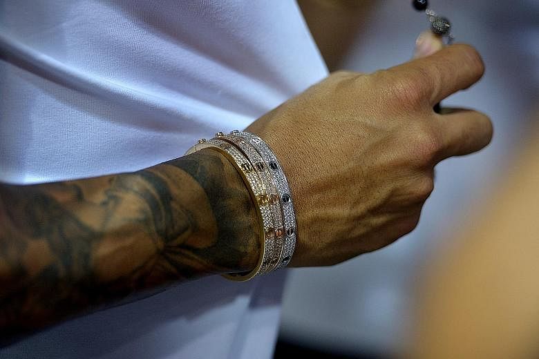 Lewis Hamilton's jet-setting lifestyle and his huge social-media appeal, combined with his penchant for Cartier bracelets, diamond earrings and tattoos, make him a superstar of the sport.
