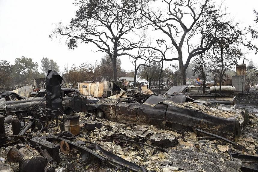 The NOAA report comes as wildfires in California continue to wreak havoc amid a sustained drought that some have linked to climate change. Right and far right: What's left of Mr Larry Menzio's tyre shop after the so-called Valley Fire swept through t