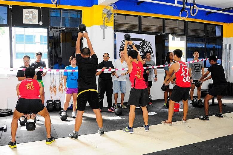 Youth beneficiaries training at Innervate CrossFit gym, the organiser of today's Operation Broken Wing event to raise money for young people helped by Reach Community Services Society. Nineteen youth at risk were picked to participate in this year's 