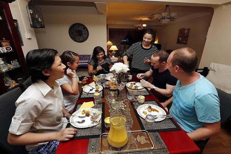 DRIVING STRANGERS AROUND: Reporter Ankita Varma driving an UberX car. STAYING IN A STRANGER'S HOME: Varma renting an Airbnb apartment in Tiong Bahru. HOSTING STRANGERS AT HOME: Varma whipping up dinner for paying guests in her home.