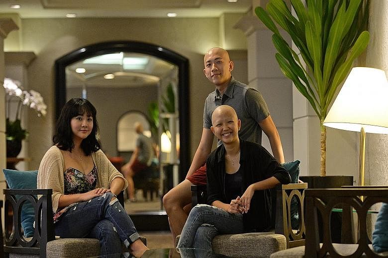 Ms Chan See Ting (seated right), reached out to fellow sufferers of alopecia areata in a Facebook post last month. Some members of the support group met yesterday for the first time, including Mr Kenneth Goh and Ms Tay Zhi Yun.