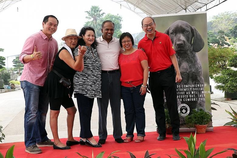 A fund-raising event for the shelter's new premises (above) was attended by (from left) Mr Kenny Eng, president of the Kranji Countryside Association; Mrs Ivy Singh-Lim; Ms Carla Barker, SPCA chairman; Mr K. Shanmugam, Ms Jasline Tan, director of Che