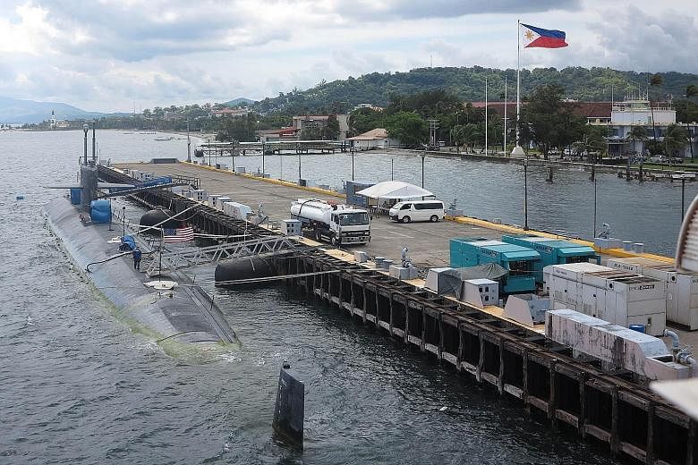 The USS Chicago, a Los Angeles-class fast-attack submarine, docking at Subic Bay port on Aug 6. Manila last year signed a 10-year agreement to allow the US to station troops, weapons and materials at bases in the Philippines, but the pact has been ti