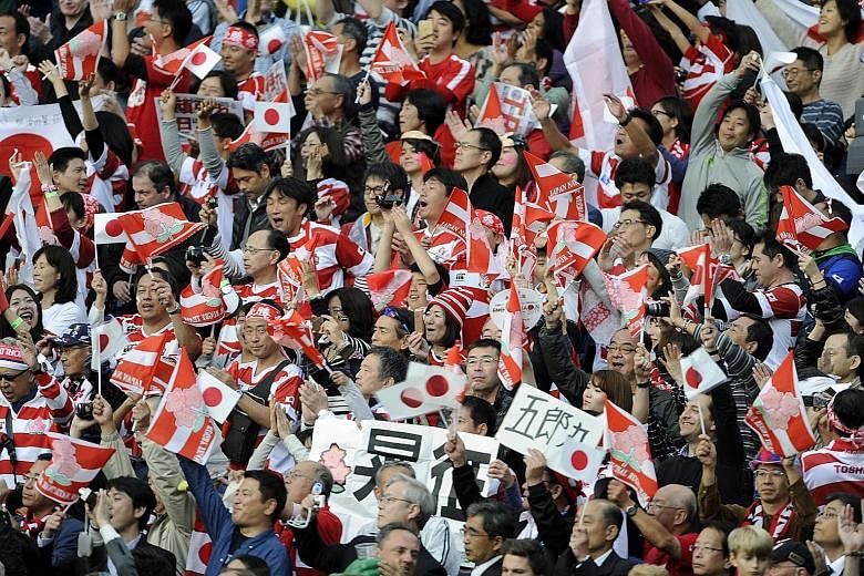 Japanese fans celebrate.