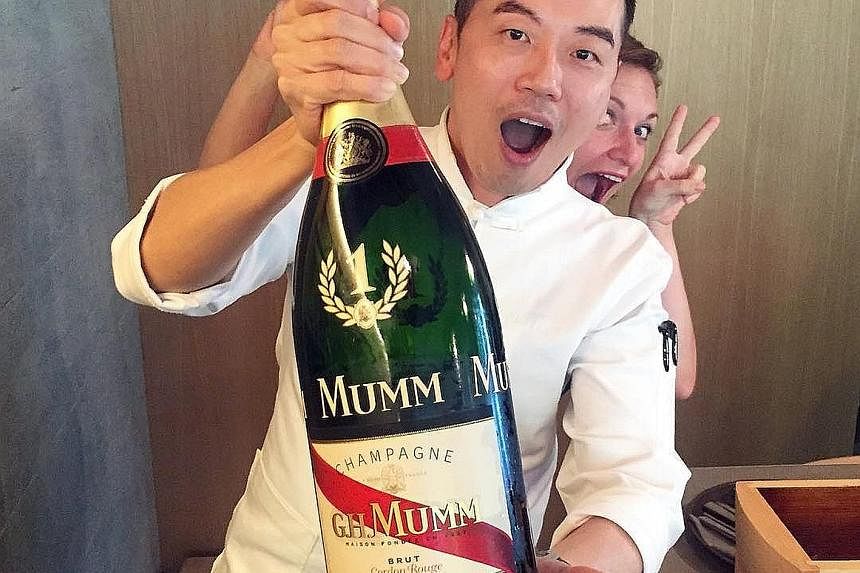 Restaurateur-chef Willin Low with last year's reserve bottle of the winner's Mumm champagne. 