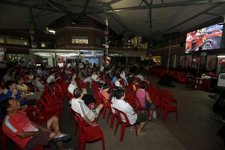 The public enjoying the screening on a 220-inch high-definition LED Video Wall at the Bishan Community Club. 