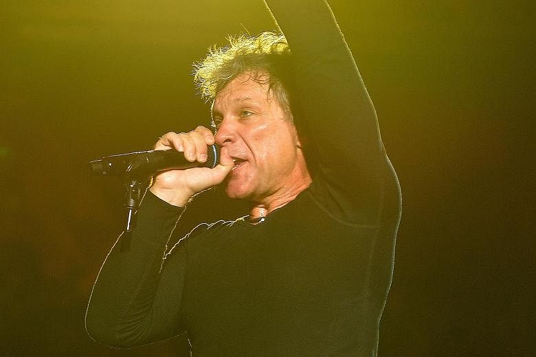 Jon Bon Jovi struggled to hit the high notes, but he worked the stage and the crowd like a consummate professional.