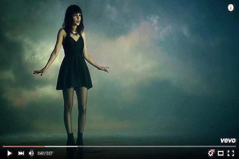 Chvrches' lead singer Lauren Mayberry was a target of sexually offensive comments after appearing in a short black dress in the music video of Leave A Trace (left).