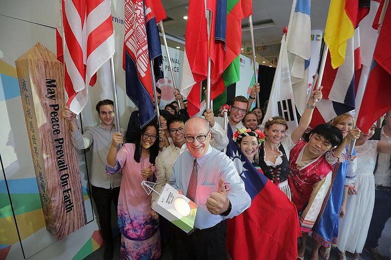 It was all peaceful, but certainly not quiet, at the Singapore Management University (SMU) campus yesterday as the university celebrated the United Nations' International Day of Peace. Students of about 40 nationalities dazzled with a colourful displ