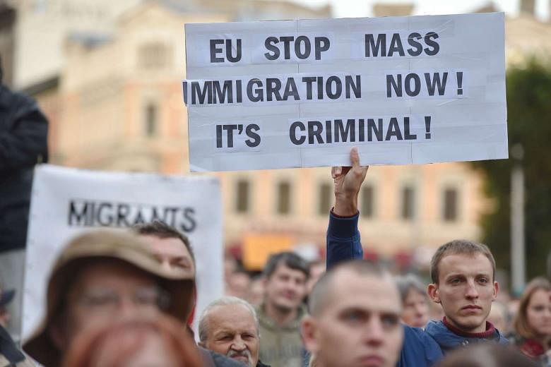 Hundreds of Latvians march against refugee quotas | The Straits Times
