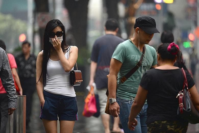 Orchard Road during the haze last week. Experts say one of the best ways to determine how unhealthy the air is in real time is to look at the one-hour PM2.5 levels published by NEA,