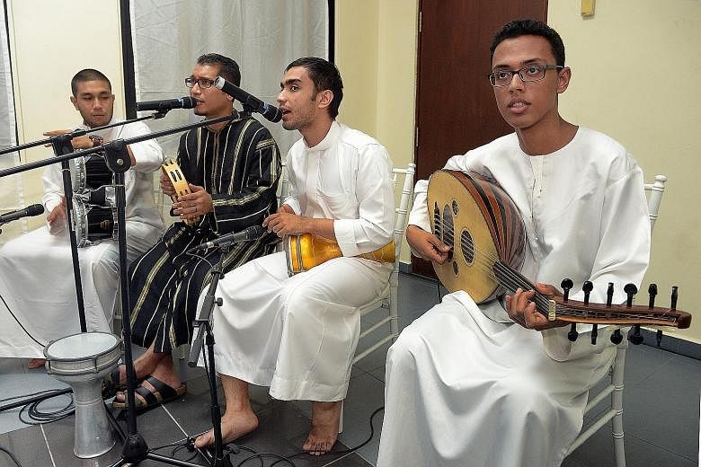 This band of Arabs comprising (from left) Abu Bakar Alwee Alsree, 24; Muhammad Hussein Alhindwan, 35; Agil Muhamad Ba'Arfan, 26; and Izzat Adnan Bin Afif, 21, performs with traditional Arab musical instruments. It was Alwehdah's main contribution to 