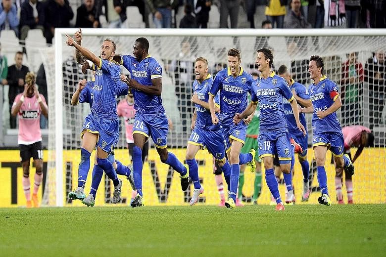 Frosinone's Leonardo Blanchard (second from right) celebrating with his team-mates after scoring against Juventus to earn the Serie A newcomers' first-ever point in the Italian top-flight.