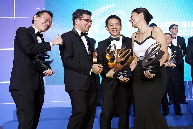 (From left) Mr Oliver Tan of ViSenze, Dr Charles Johnson of Hope First Response, Mr Ven Chin of GD Group and Ms Cecilia Chow of Zweec Analytics, with their trophies on Wednesday night. Zweec Analytics also bagged the Best Innovation Award and ViSenze