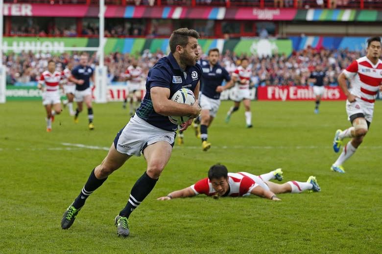 Mark Bennett running through to score the third try for Scotland against Japan. Scotland won the Pool B game 45-10 with five second-half tries. 
