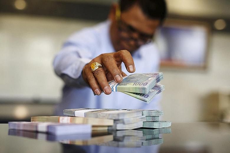 The rupiah saw its steepest weekly drop in almost two years amid worsening growth and signs that the US will raise interest rates this year.