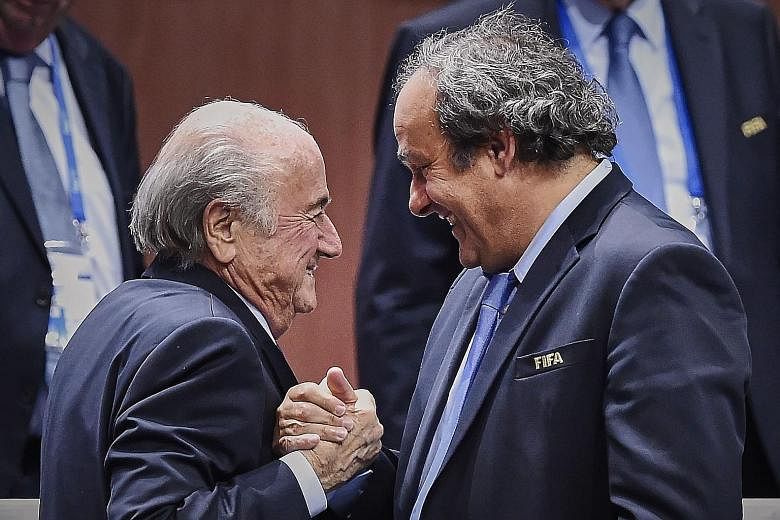 Sepp Blatter (far left, with Michel Platini) has cut a lonely figure since Fifa became embroiled in a corruption scandal. He has always denied wrongdoing and was set to step down as president next year.