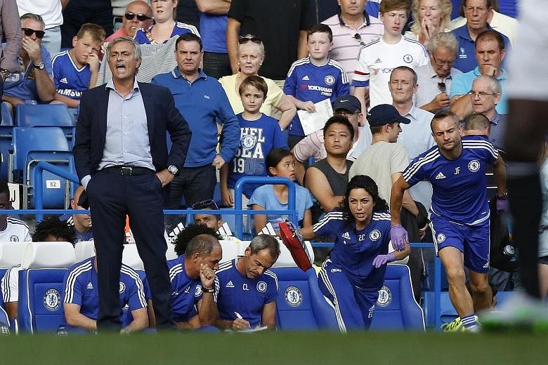 Chelsea manager Jose Mourinho (far left) lost his cool after the team's doctor Eva Carneiro and head physio Jon Fearn (right) rushed off the bench to treat midfielder Eden Hazard during their English Premier League football match against Swansea on A