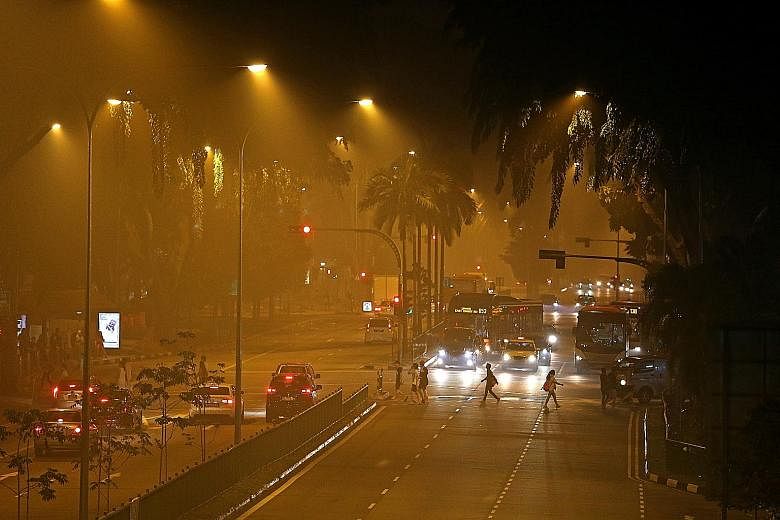 The hazy streets near AMK Hub in Ang Mo Kio last Thursday night. There were as many as 170 tweets a minute at about 9:30pm last Thursday, when the authorities announced that primary and secondary schools would be closed the next day. The three-hour P