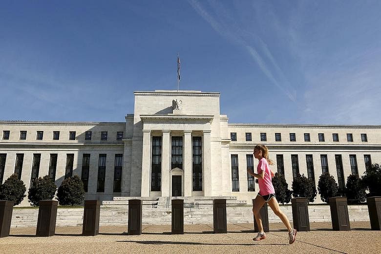 The decision by the US Fed (left), to keep its benchmark short-term interest rate steady at near zero, still spells uncertainty for the market.