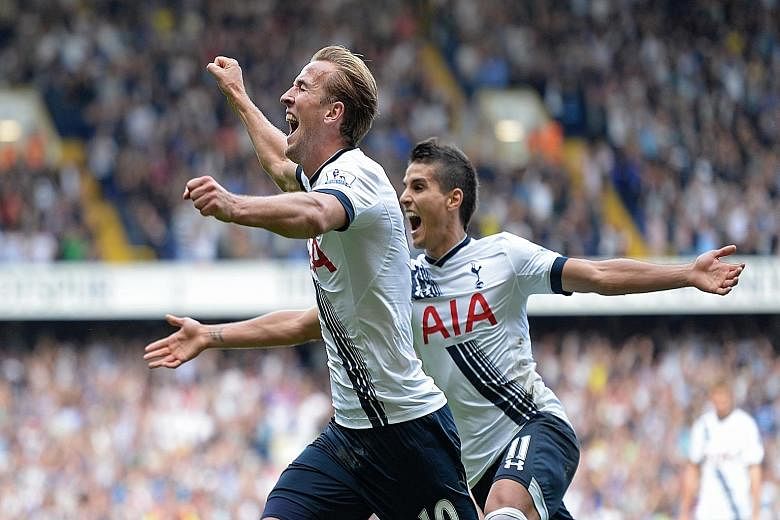 Tottenham Hotspur's Harry Kane (left) and Erik Lamela celebrating the former's goal in a 4-1 rout of Manchester City. It was Kane's first goal of the season. The loss was Man City's second straight league defeat, allowing rivals Manchester United to 