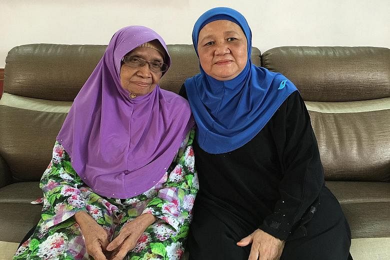 Madam Amedah Osman (far right) with her adoptive mother, Madam Ruminah Jaafar. Above, the birth certificate which states Jalan Besar as the address of her biological parents.