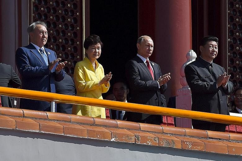 At China's military parade on Sept 3 were (from left) Kazakhstan President Nursultan Nazarbayev, South Korean President Park Geun Hye, Russian President Vladimir Putin and Chinese President Xi Jinping.