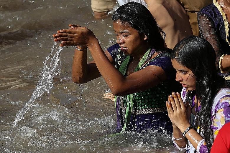 Devotees taking a holy dip in the Godavari River during a Hindu festival last week. While the Modi government feels the interlinking of rivers programme is essential for India's water and food security, environmentalists say the project would affect 