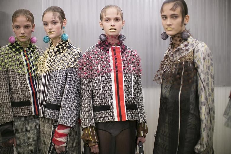 Tweeds, wools and plaids turned up in Prada's version of the skirt suit.