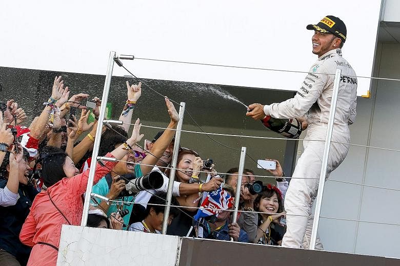 Lewis Hamilton's success at Suzuka puts him in a bubbly mood, given that he now enjoys a 48-point advantage over team-mate Nico Rosberg in the chase for the drivers' title, with five races left.