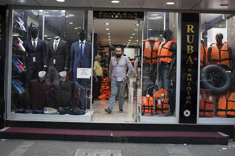 A shop in Izmir selling life vests. A multimillion-dollar shadow economy has developed in Turkey, profiting from the massive human tide rushing towards Europe. There is no sign that the outflow will wane as long as there is so much money to be made.