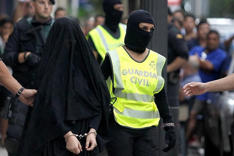 Spanish police in Gandia city arresting an 18-year-old Moroccan suspected of recruiting other women for ISIS via the Internet earlier this month.