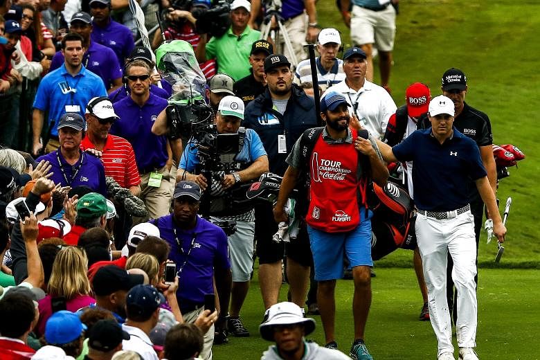 Jordan Spieth, with a crowd following him to the 18th green, nails a sensational season with his Tour Championship win.