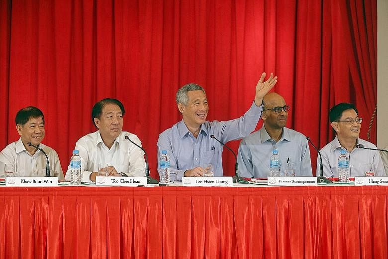PM Lee Hsien Loong taking questions from reporters at the press conference in the Istana yesterday. With him are (from left) incoming Transport Minister Khaw Boon Wan, who will tie urban planning and infrastructure together, DPM Teo Chee Hean, who wi