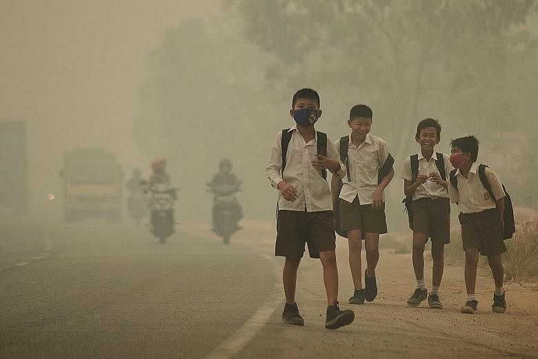 Students in Indonesia's Jambi province were released from school earlier because of the worsening haze yesterday. Indonesia has struggled to put out illegal forest fires in Sumatra and Kalimantan that have blanketed many parts of the country, Singapo