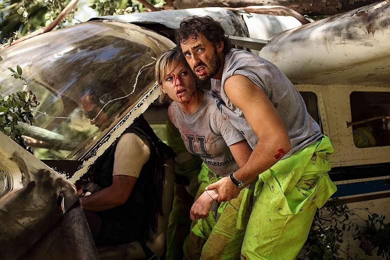 Ignacia Allamand (left) and Ariel Levy are attacked by cannibals in The Green Inferno.