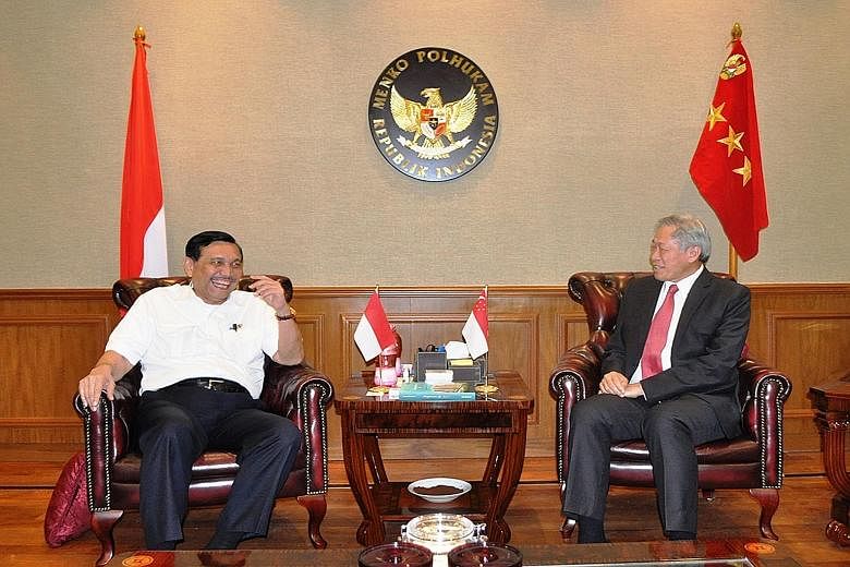 Dr Ng Eng Hen (right) calling on Indonesia's Coordinating Minister for Political, Legal and Security Affairs Luhut Panjaitan on Monday. During the talks, Dr Ng raised the SAF's offer to help Indonesia deal with forest fires.