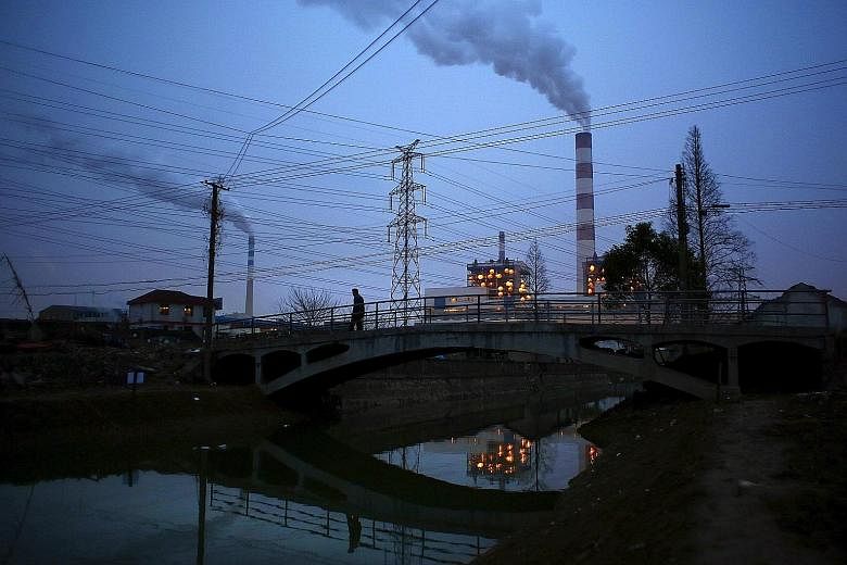 Smoke rising from a thermal power plant in Shanghai. China's earlier attempts to put a price on carbon, with pilot programmes in seven cities and provinces, yielded mixed results due to unclear rules and inexperienced regulators