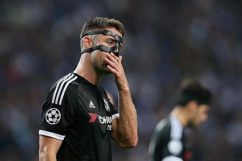 Defender Gary Cahill is a picture of disappointment after Chelsea are beaten by Porto. The London club were unrecognisable from the champions of last season.
